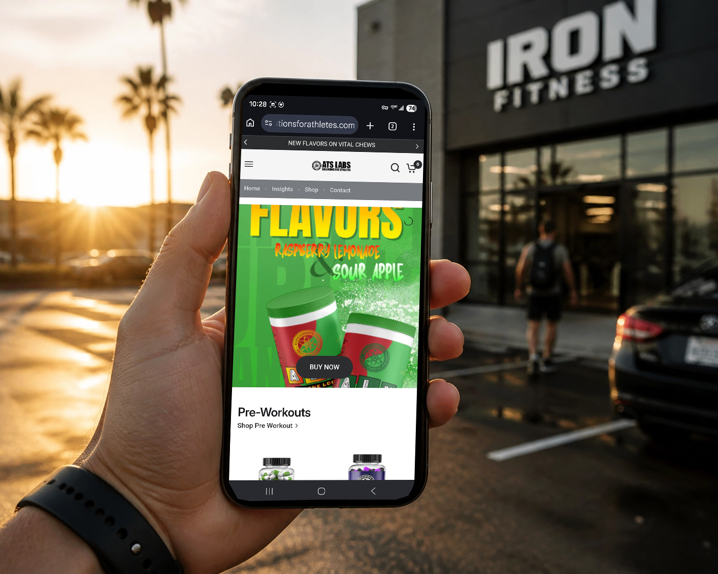 Mobile-first e-commerce website design for ATS Labs viewed on a smartphone in an athletic setting.